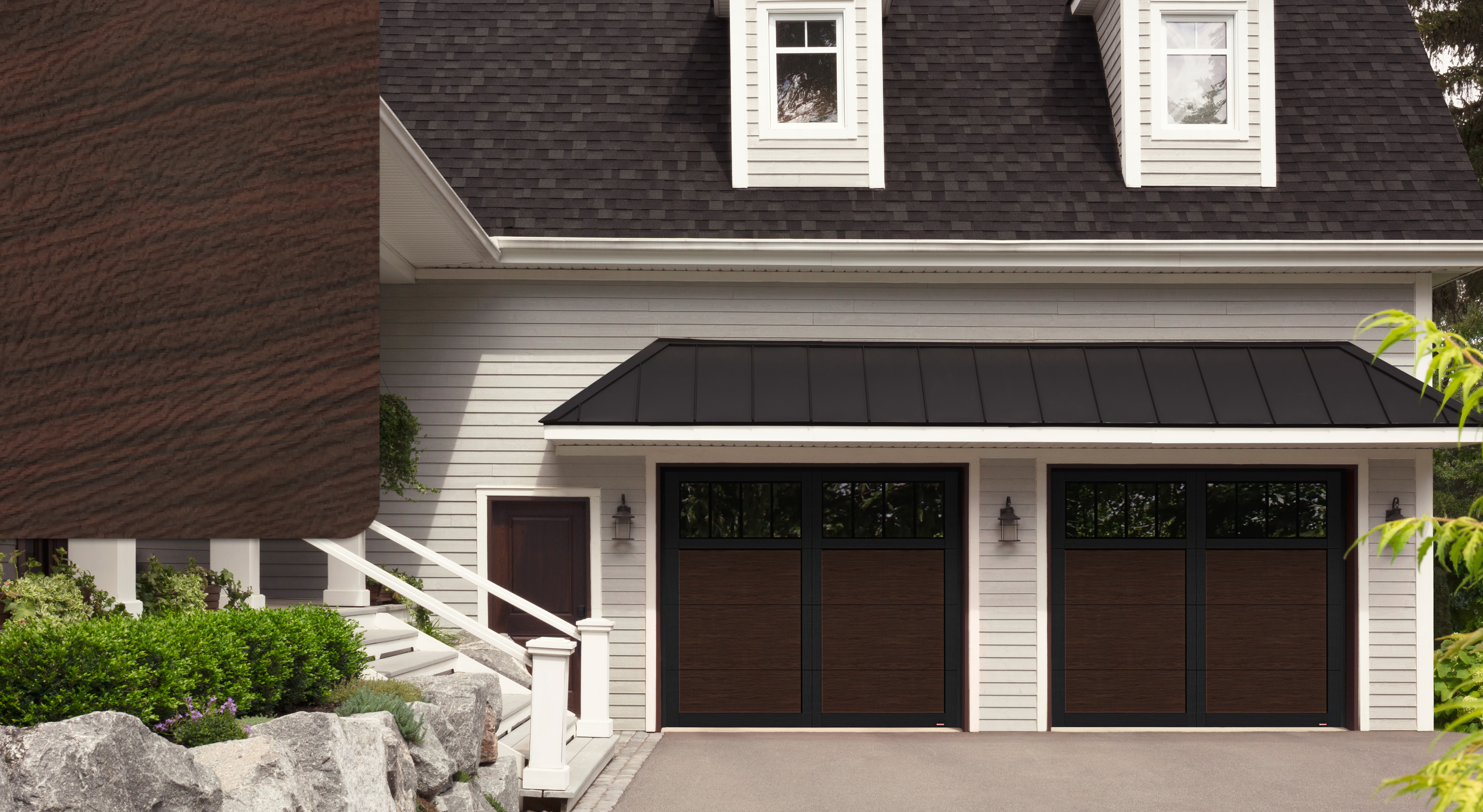 White house with Princeton P-11 garage doors, 9' x 8' Dark Walnut and Black moldings, Panoramic 4 rectangles windows with Clear windows and a Dark Walnut sample