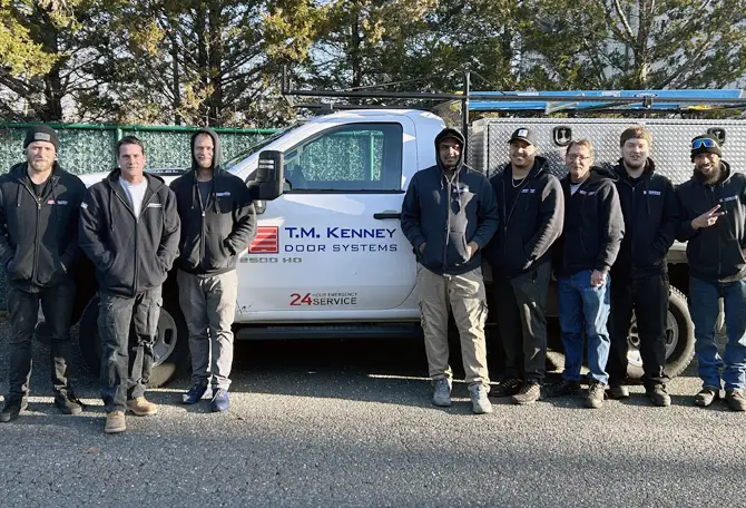 T.M Kenney Door Systems technicians in front of a truck services